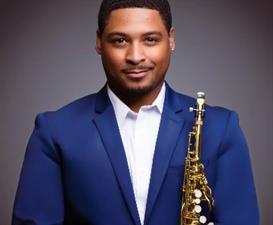 Harold Dawson performing on saxophone at Geneva Commons Center Stage